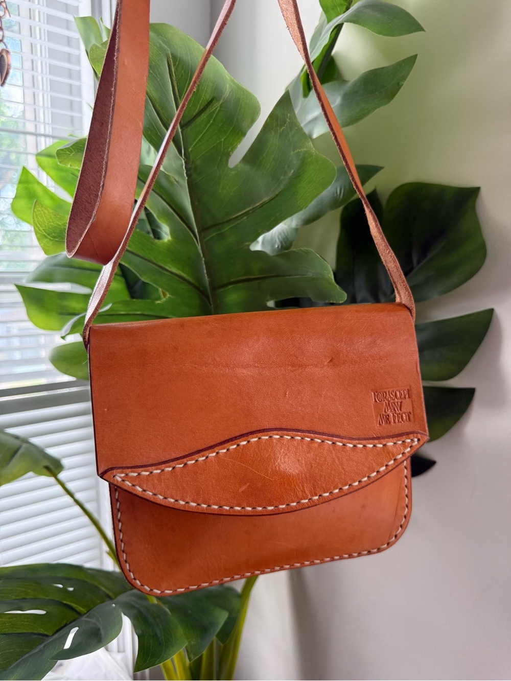 Handcrafted Tan Leather Messenger Bag with Embossed Logo